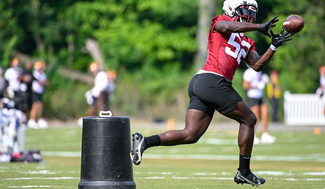 Washington Commanders linebacker Jamin Davis (52) catches the football during the second day of training camp at the OrthoVirginia Training Center at Commanders Park in Ashburn, Virginia, July 27, 2023. (Photo by Brian Murphy)