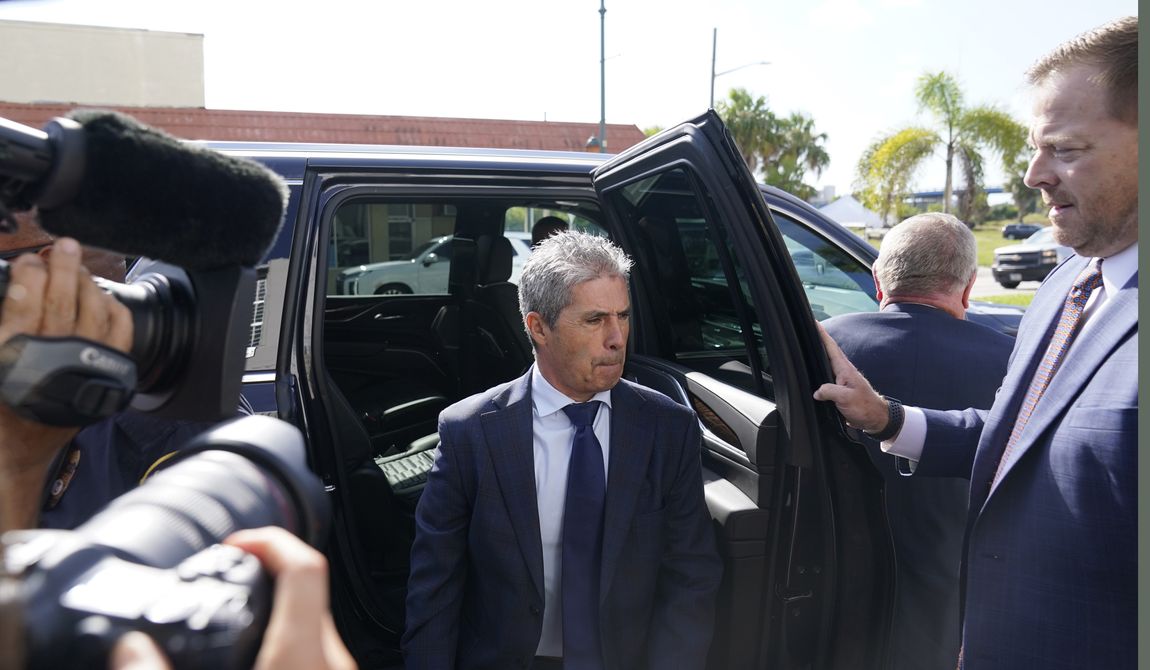 Carlos De Oliveira, center, the property manager of Donald Trump&#x27;s Mar-a-Lago estate, arrives at the Alto Lee Adams Sr. U.S. Courthouse, Thursday, Aug. 10, 2023, in Fort Pierce, Fla.    De Oliveira was scheduled to be arraigned on charges including conspiracy to obstruct justice in the case brought by special counsel Jack Smith. (AP Photo/Wilfredo Lee)