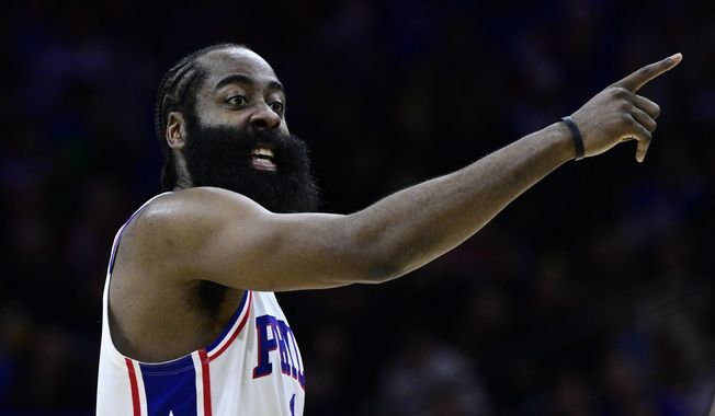 FILE - Philadelphia 76ers&#x27; James Harden plays during an NBA basketball game against the Denver Nuggets, Saturday, Jan. 28, 2023, in Philadelphia. Harden appears determined to sever ties with the Philadelphia 76ers after the star guard called team president Daryl Morey a liar at a promotional event at China. (AP Photo/Derik Hamilton, File)