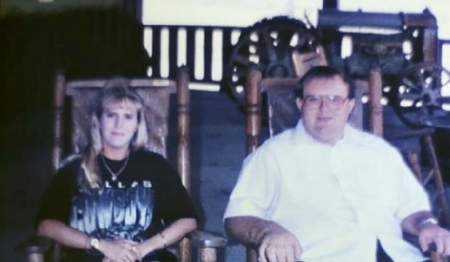 In this photo taken sometime in the early 2000s provided by Kymberly Hobbs, Hobbs poses next to her brother, Charles Givens. The FBI is investigating the death of Givens, an intellectually disabled inmate at a Virginia prison as “the victim of a possible crime,” after a lawsuit filed by Hobbs, alleged the man was brutally beaten by correctional officers, according to a document reviewed Monday, July 24, 2023, by The Associated Press. (Courtesy of Kymberly Hobbs via AP)