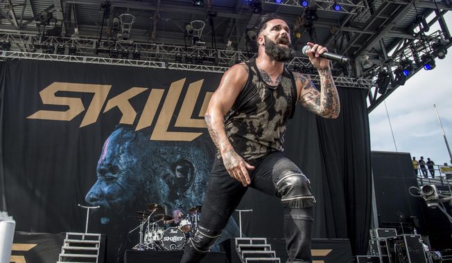 In this May 20, 2017, photo, John Cooper of Skillet performs at Rock On The Range Music Festival in Columbus, Ohio. More and more performers are changing live concerts plans because of the new coronavirus, which has forced Mariah Carey, BTS, Pearl Jam and even the Coachella festival to postpone dates. Skillet is performing the last several dates on their current tour, with shows in New York and Virginia taking place this week. Despite the spread of the virus, Cooper said he and his bandmates are still holding meet-and-greets with concertgoers. (Photo by Amy Harris/Invision/AP) **FILE**