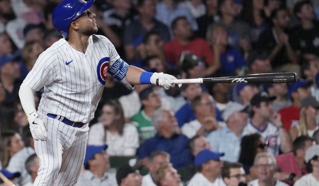 Chicago Cubs&#x27; Nick Madrigal watches his solo home run during the eighth inning of a baseball game against the Chicago White Sox in Chicago, Wednesday, Aug. 16, 2023. (AP Photo/Nam Y. Huh)