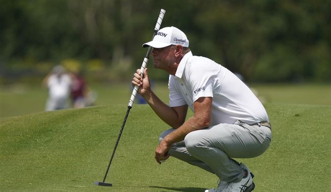 Lucas Glover lines up a putt on the first hole during the final round of the Wyndham Championship golf tournament in Greensboro, N.C., Sunday, Aug. 6, 2023. (AP Photo/Chuck Burton)