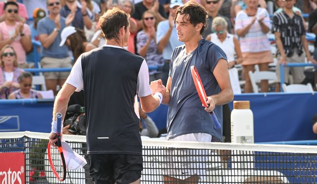 No. 1 seed Taylor Fritz of the United States (right) meets No. 15 seed Andy Murray of Great Britain after their match at the D.C. Open in Washington, D.C., on Fri., Aug. 4, 2023. Fritz won 6-7 (2), 6-3, 6-4. (Billy Sabatini/All-Pro Reels)
